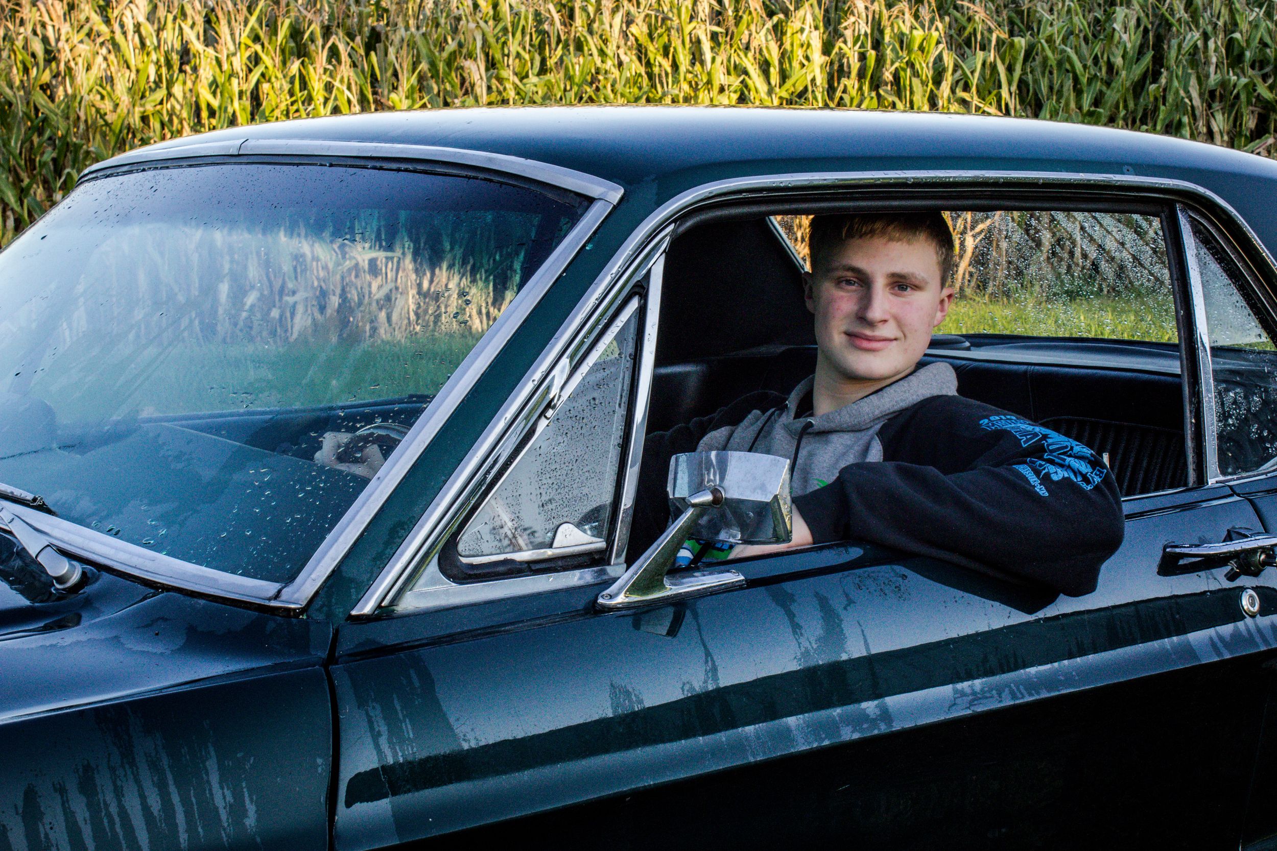 Classic car portrait series featuring vintage blue automobile at dusk.