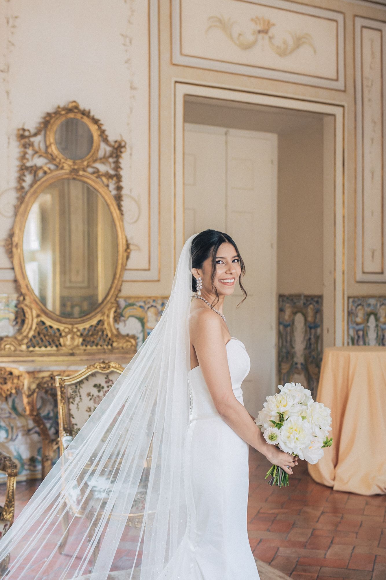 indian bride in white dress photographed by an Indian destination wedding photographer in Portugal – Correio Mor Palace