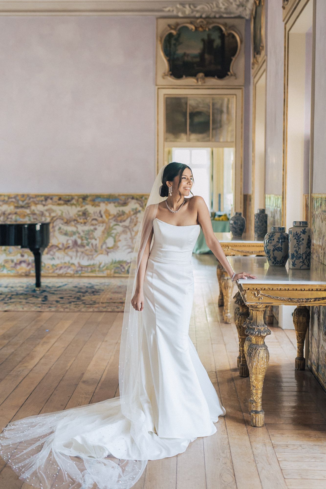 indian bride in white dress photographed by an Indian destination wedding photographer in Portugal – Correio Mor Palace