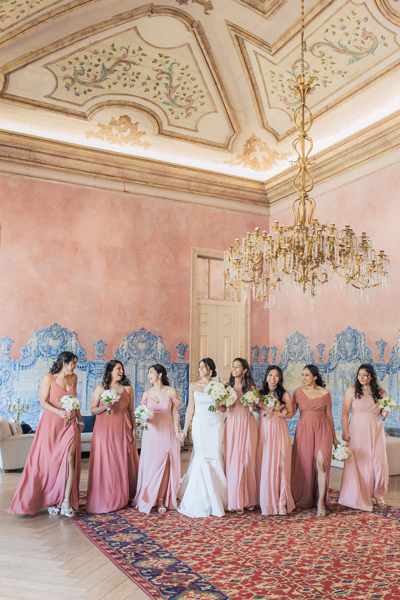 bridesmaids in pink dresses photographed by an Indian destination wedding photographer in Portugal – Correio Mor Palace