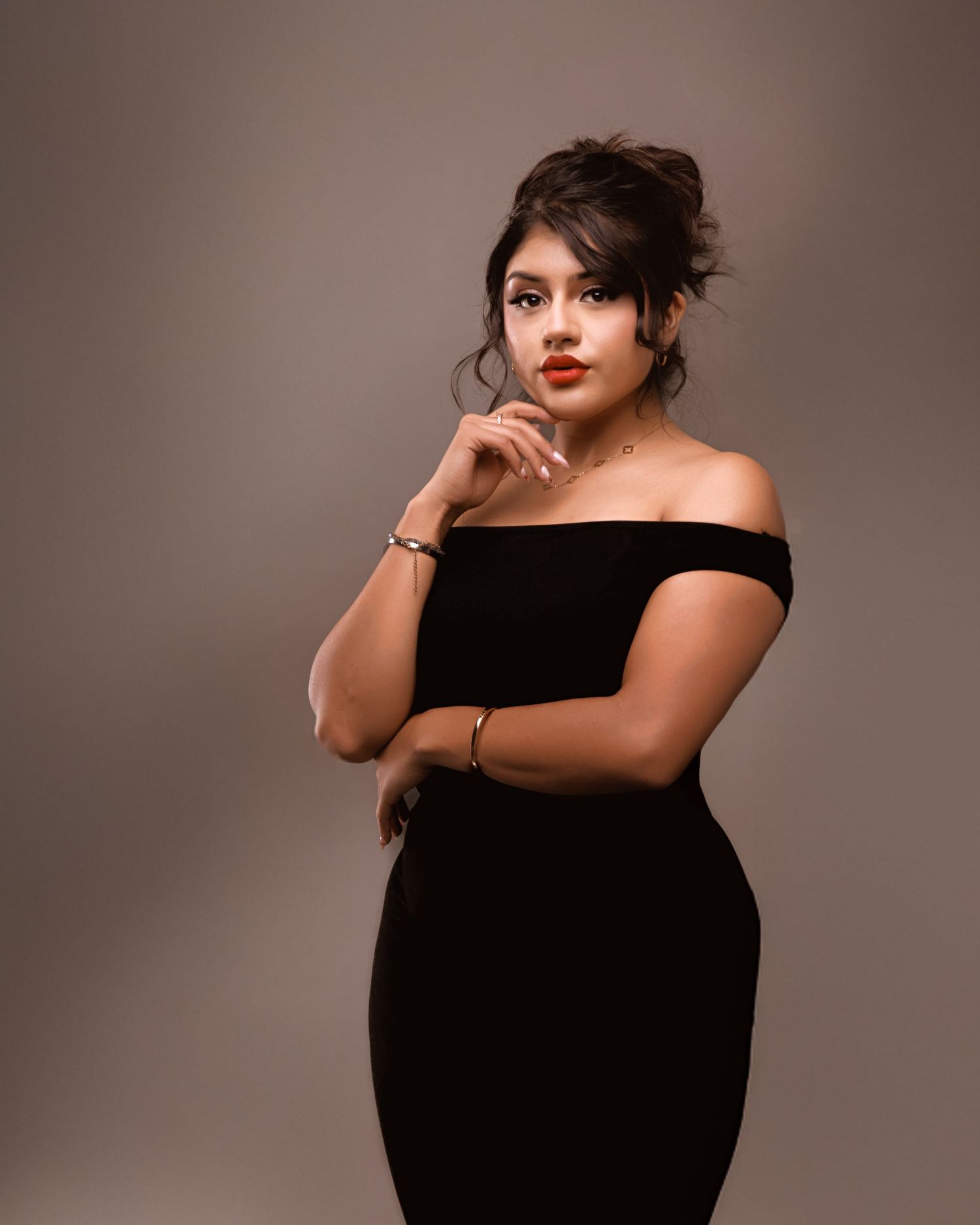 A series of elegant studio portraits featuring someone in a black dress against a neutral brown backdrop.