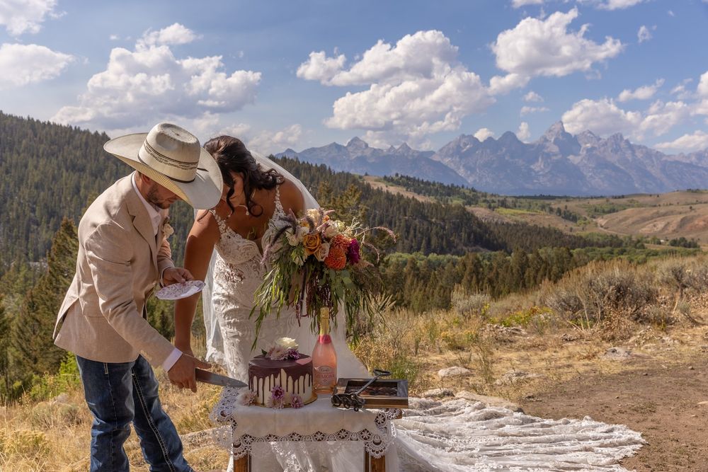 Couple enjoys a scenic mountain vista during their wedding photo session in Grand Teton National Park.