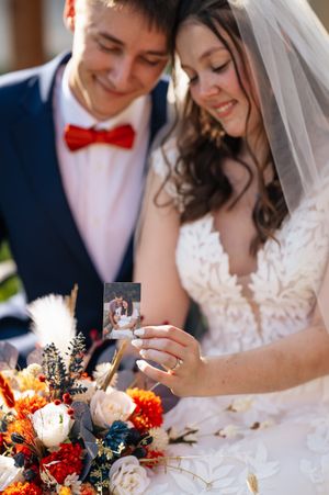 A romantic wedding photo collage showing close-up moments with autumn-colored flowers and white bridal details.