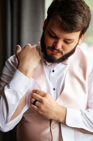 A series of photos showing a person in a white button-down shirt adjusting their collar and sleeve cuffs.