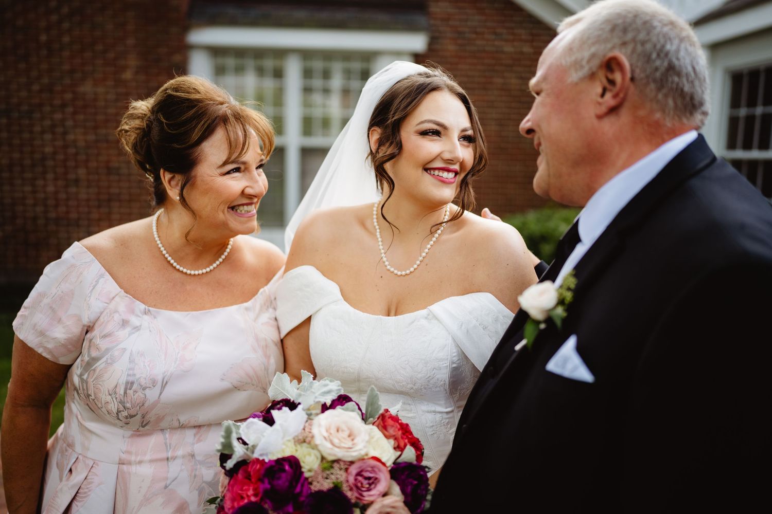 Three candid moments during a wedding celebration show joyful interactions between wedding party members in elegant attire.