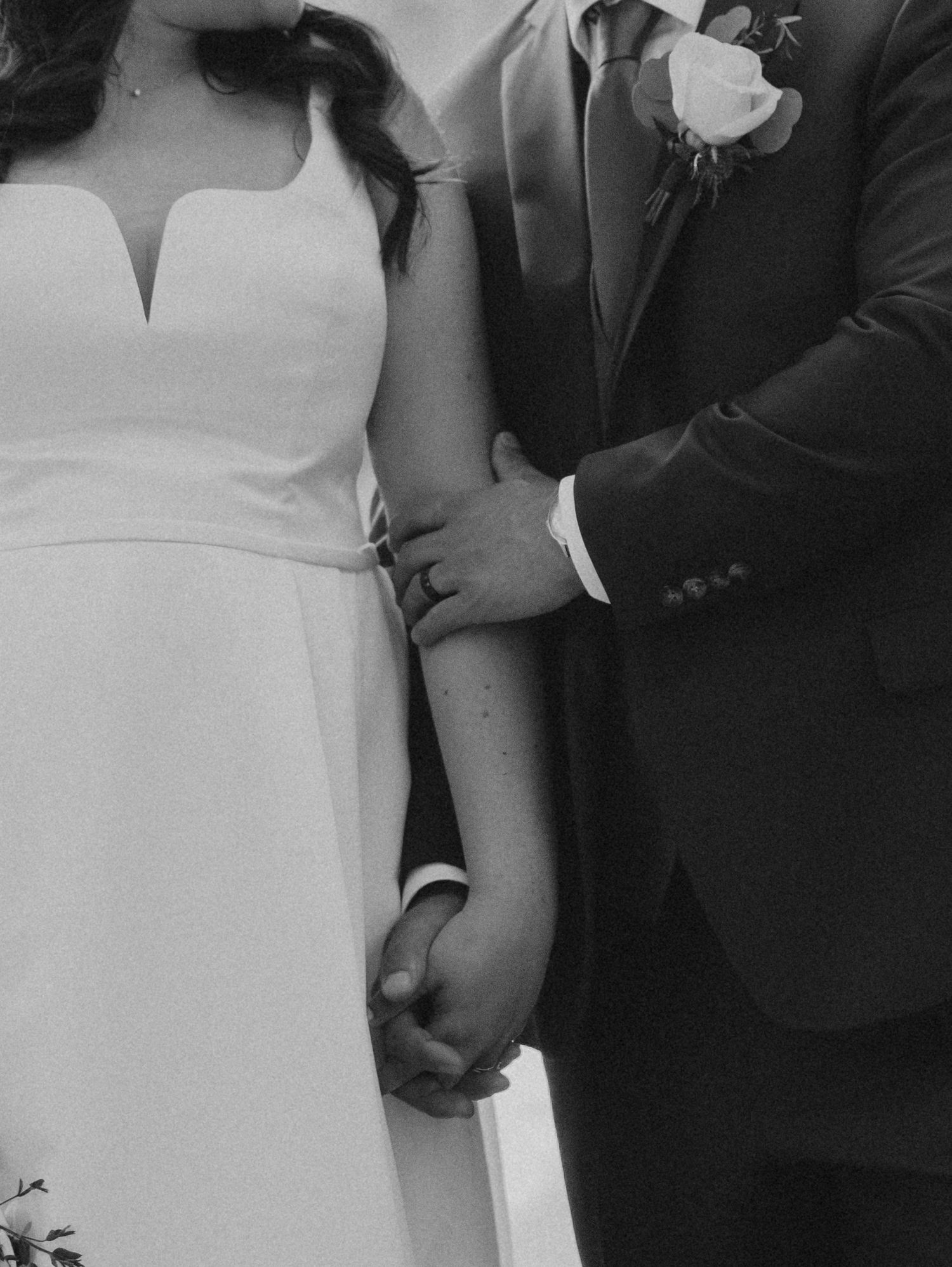 A romantic black and white photo series capturing intimate moments of a bride and groom at their wedding.