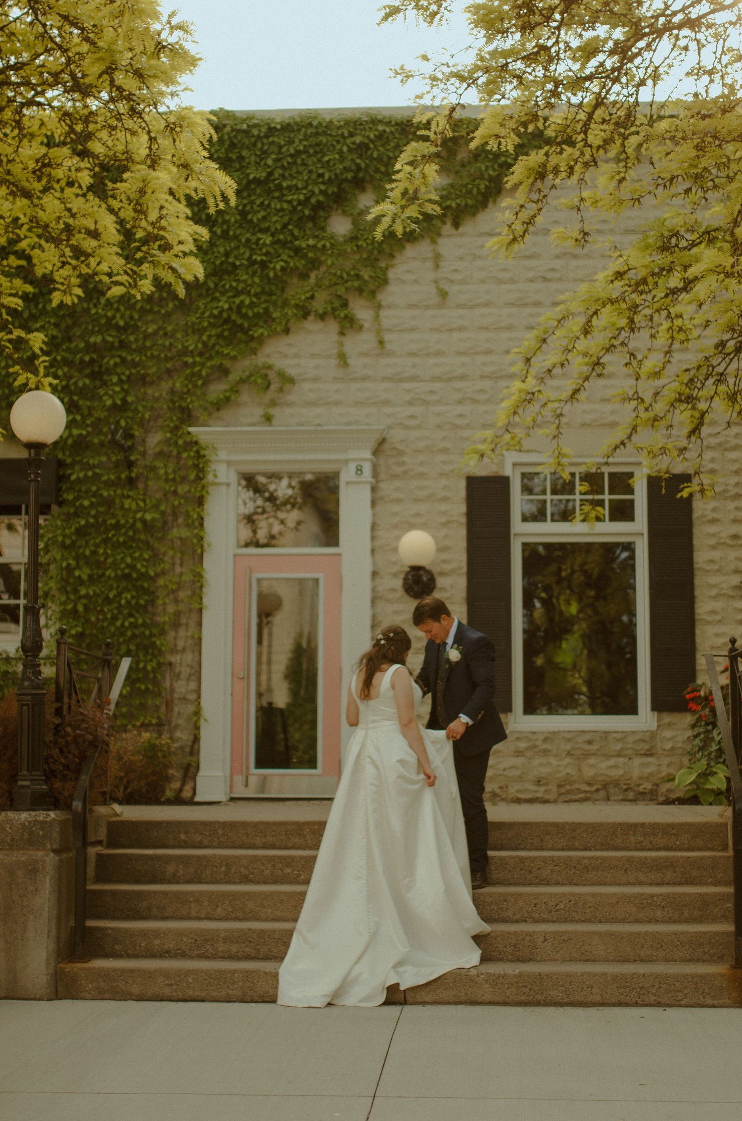 Series of wedding photos showing a couple against an ivy-covered building in warm tones.