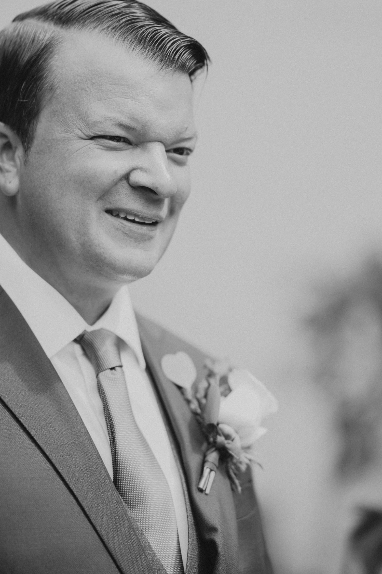 A series of black and white close-up shots showing joyful expressions during a wedding ceremony.