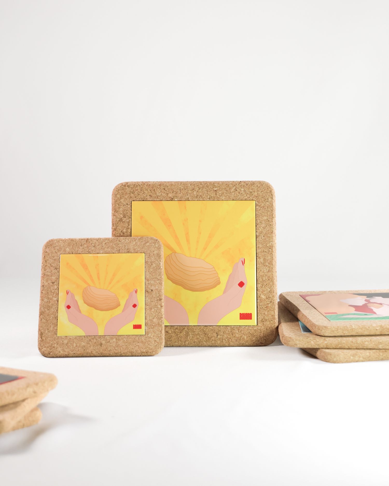 Cork-framed illustrations with sun rays and romantic designs on white background.