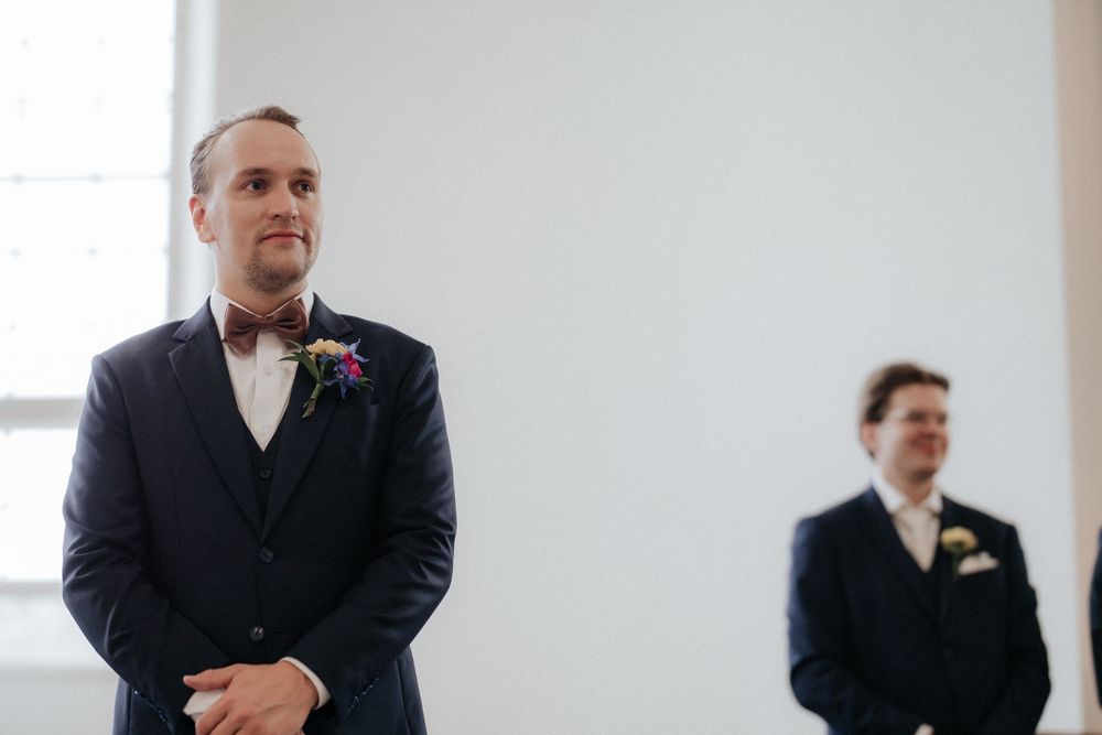 A series of five candid photos showing joyful moments during a formal wedding ceremony celebration.
