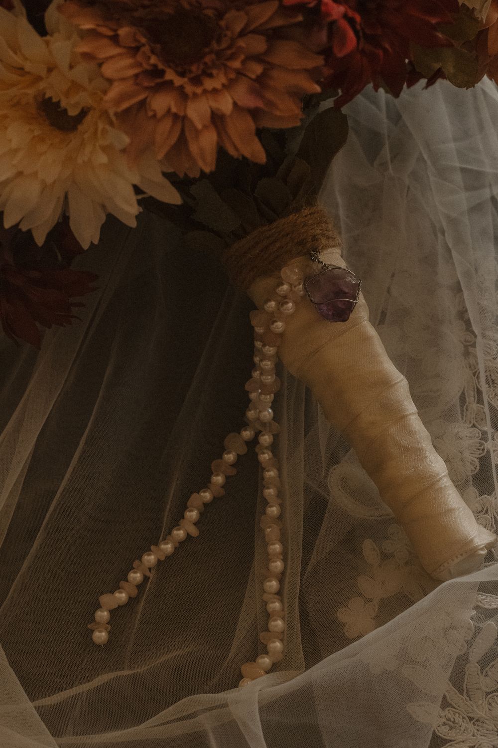 Close-up of wedding dress details with lace trim and tulle fabric.