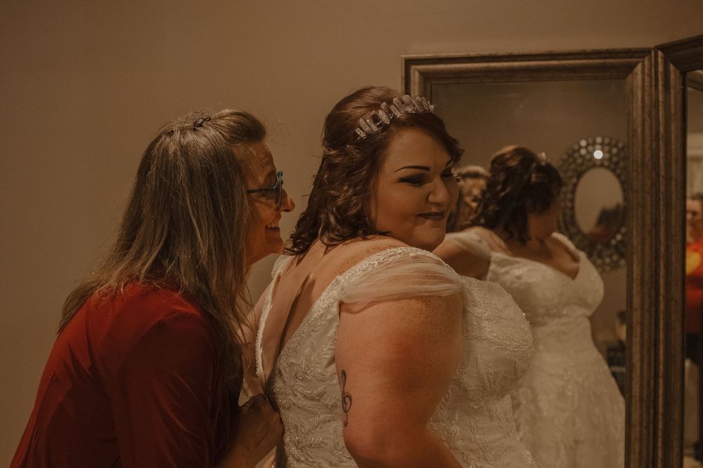 Wedding celebration scene with people gathered in an indoor venue.