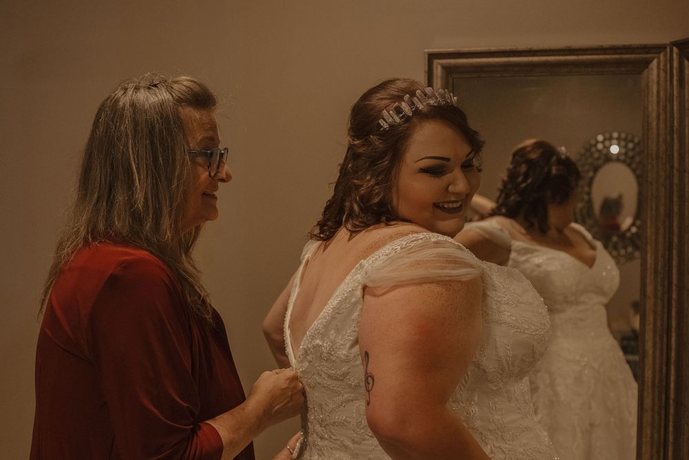 Group of wedding guests celebrating in formal attire.