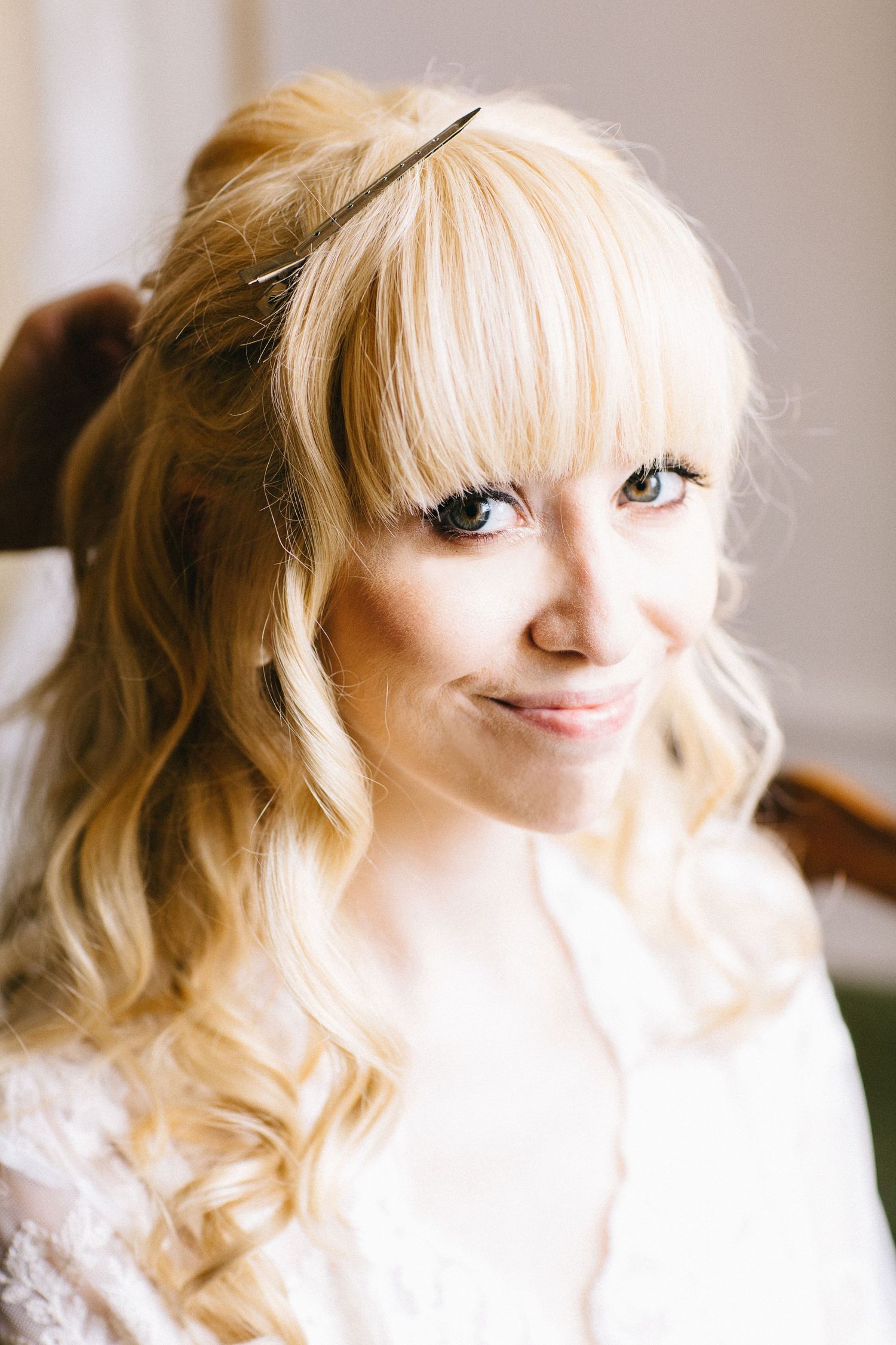Close-up portrait shots showing bright blonde hair and bangs against a light background.