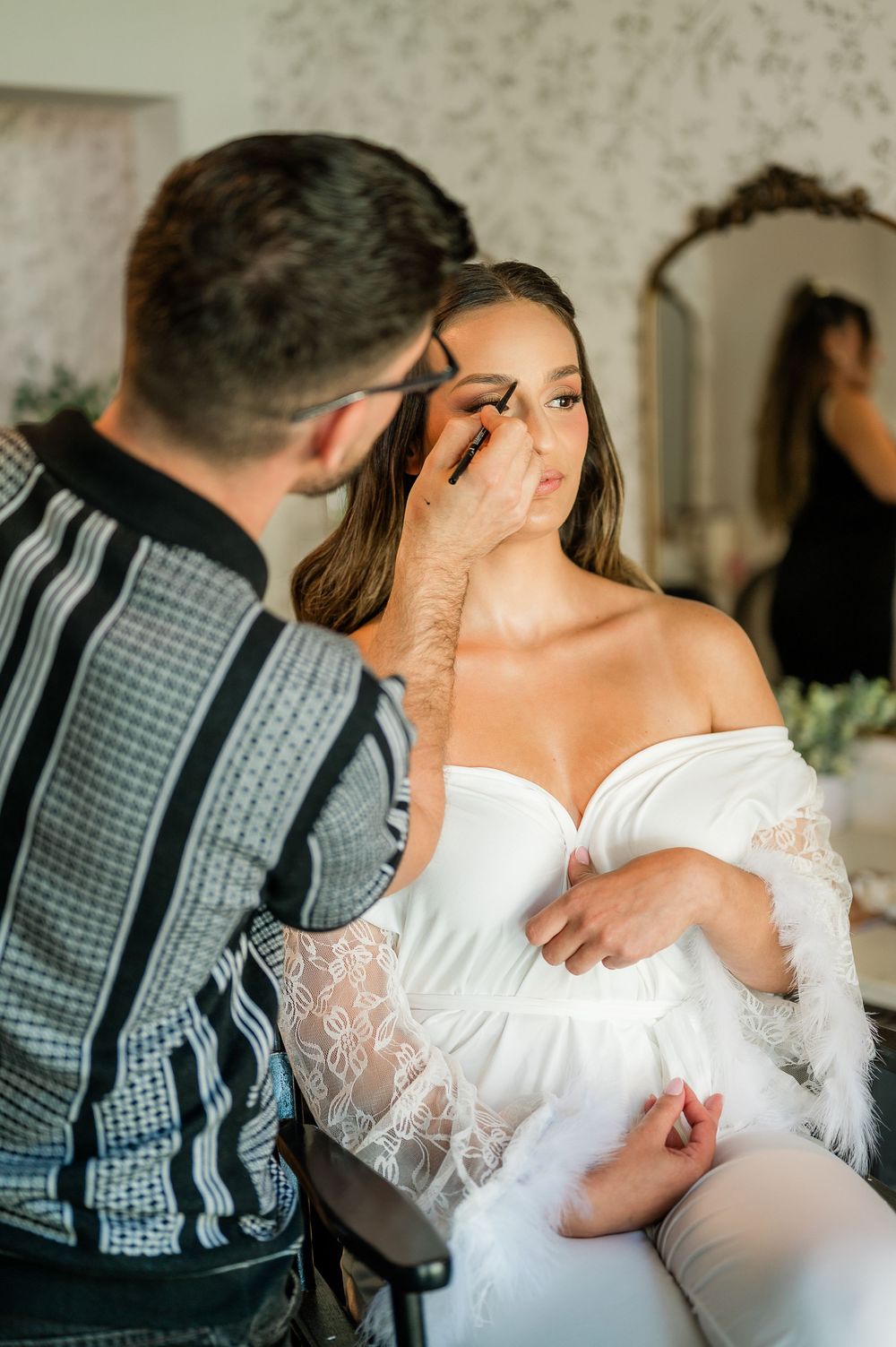 Romantic close-up sequence of a tender wedding moment between a couple in elegant attire.