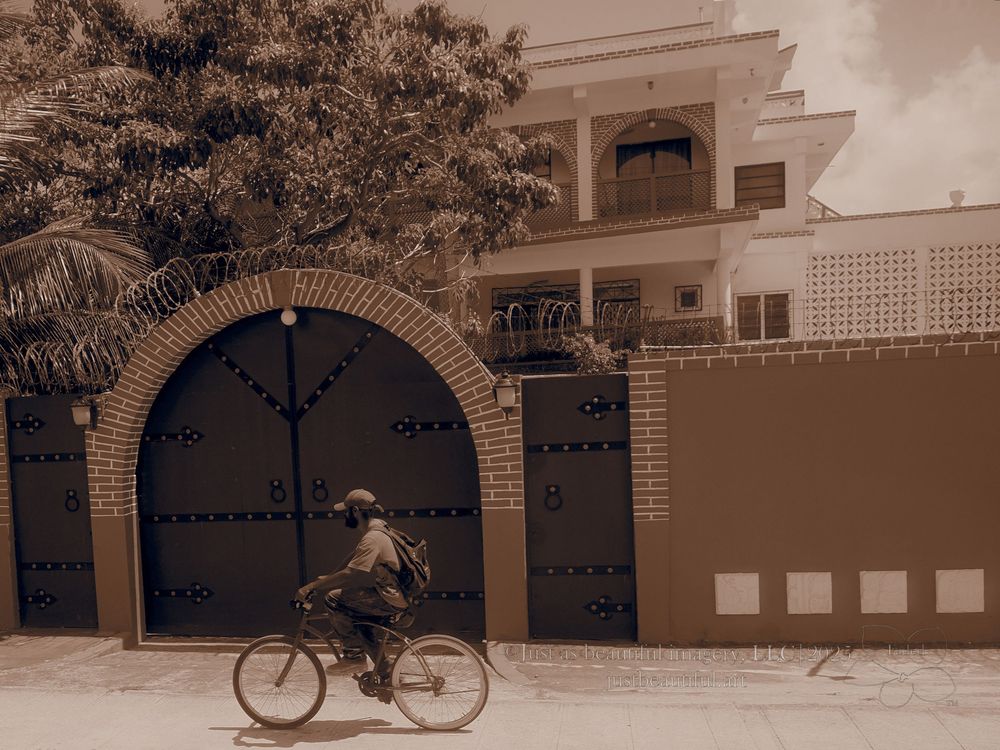Faded photo of bicyclist in Belize.