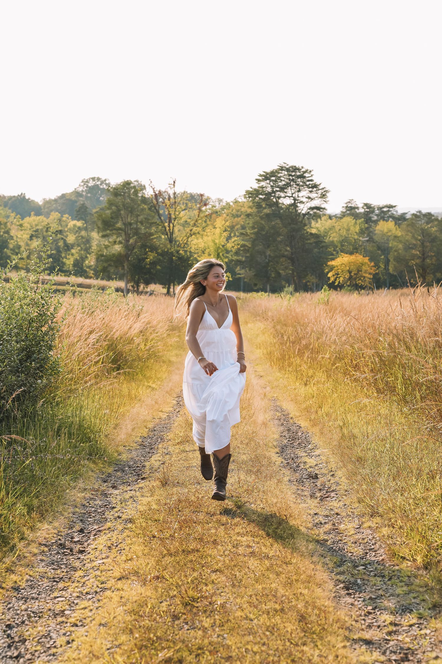 Graduation portrait session in the Manassas, Virginia - beautiful tall grass field | Senior photos by Alina Phillips Photography.