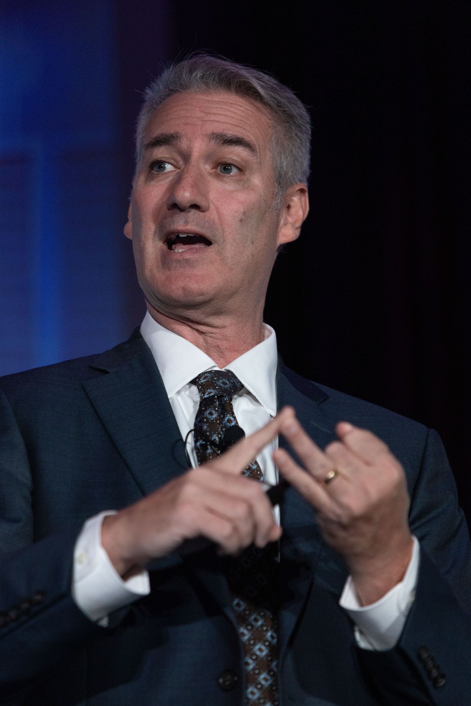 A man speaks during a conference in Sarasota, FL.