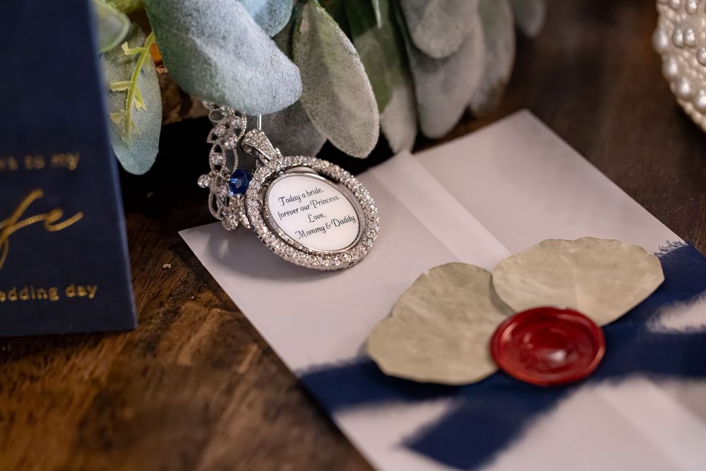 A collection of stamps, letters and postage materials arranged on a desk in a vintage postal theme.