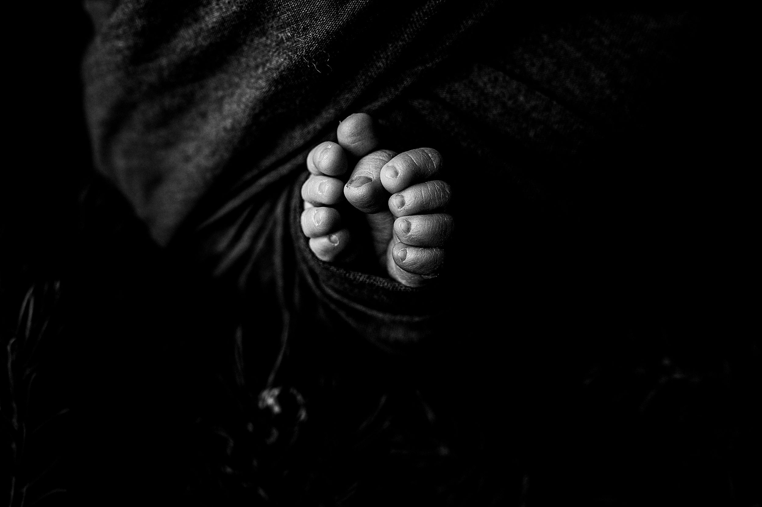 Black and white photo series showing close-up details of hands and fingers in various expressive poses and gestures.