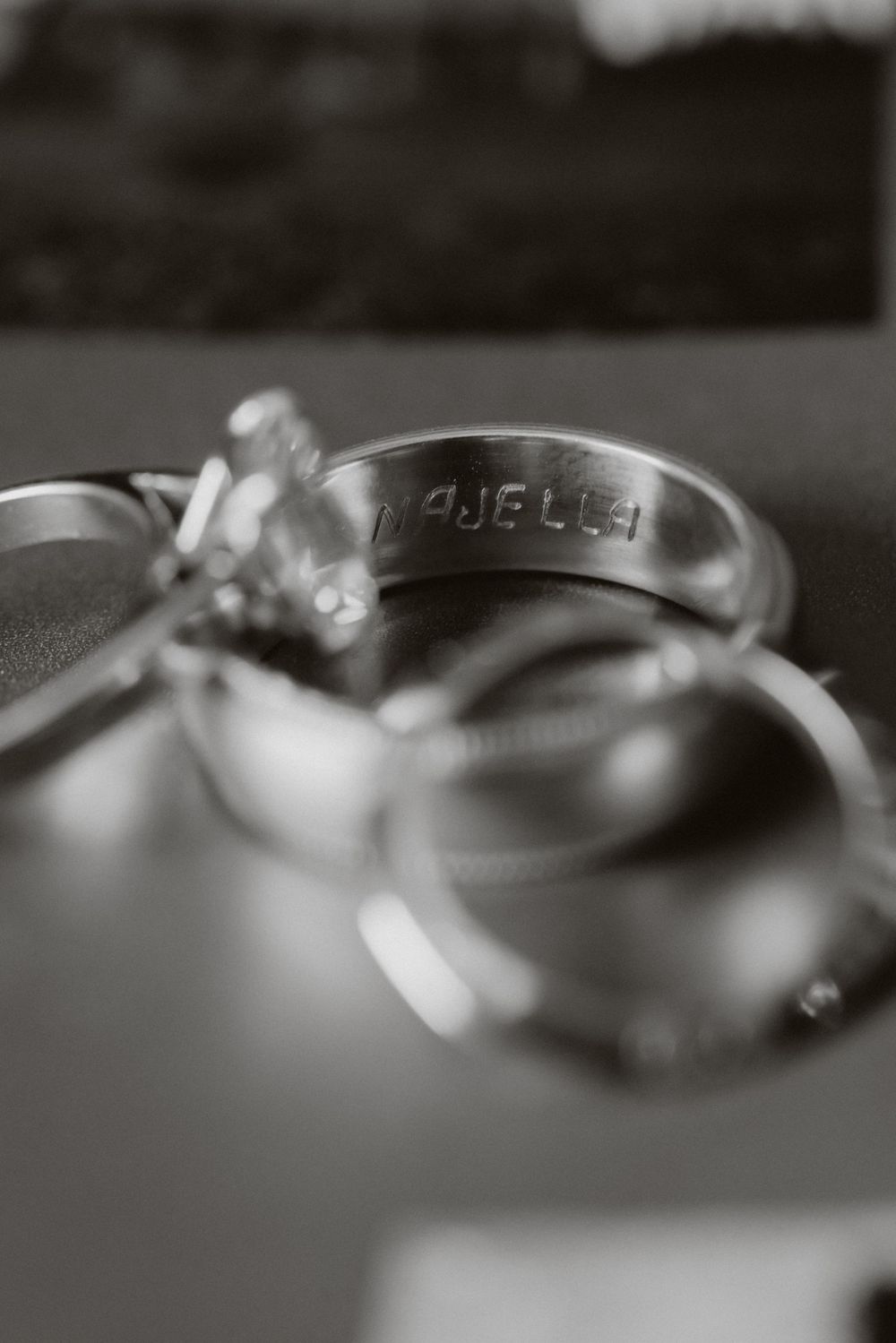 Macro close-up shot of multiple wedding rings arranged in a row with selective focus creating a blurred effect.