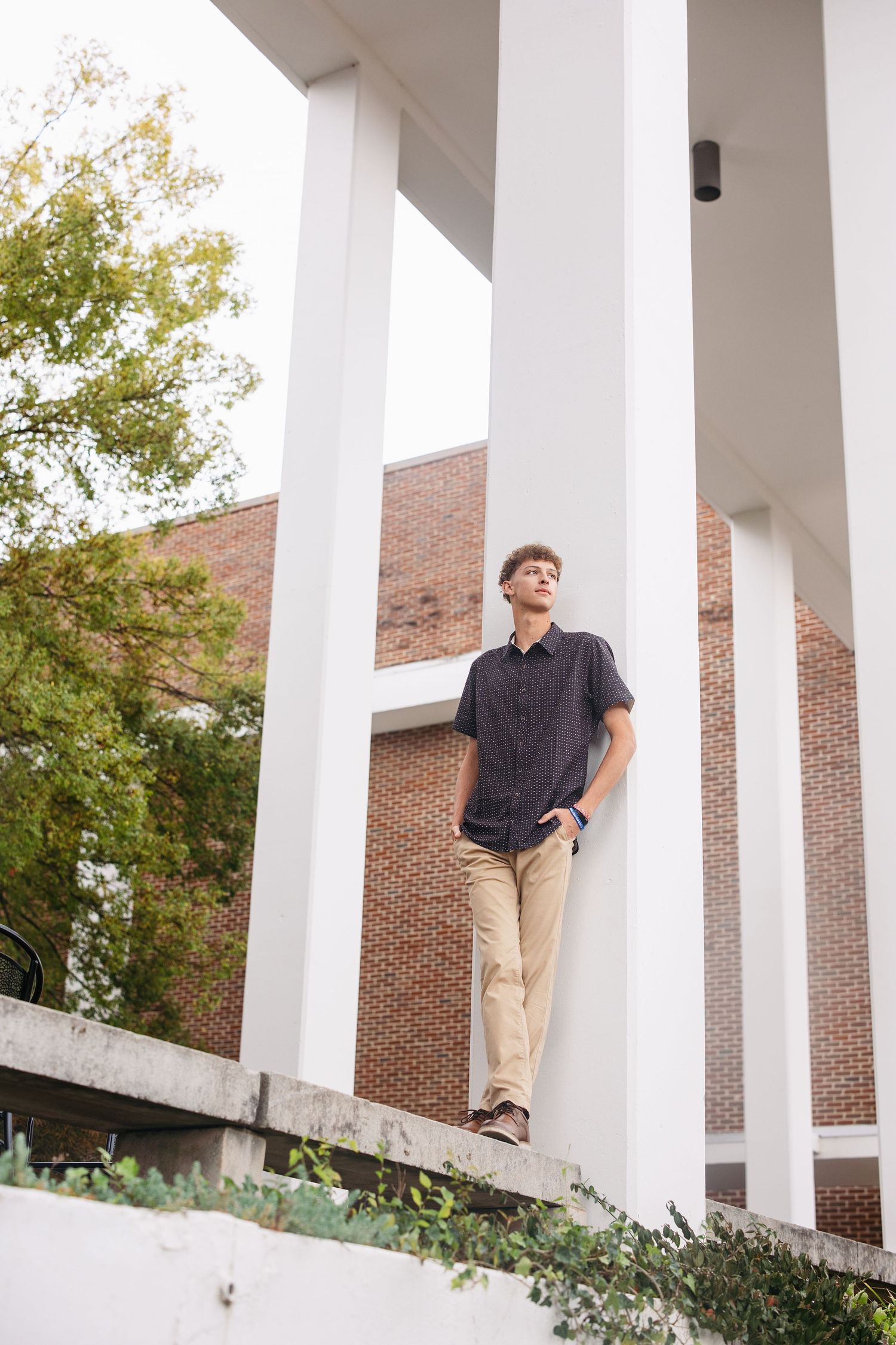 A series of outdoor portrait photos showing someone in a gray polo shirt and khaki pants against a blurred natural background.