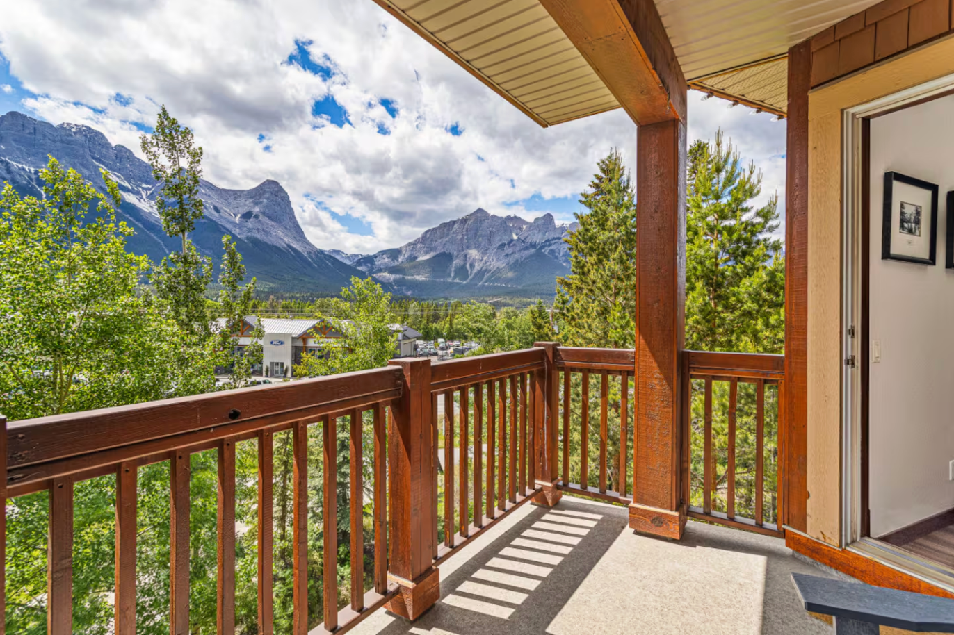 a balcony in Canmore with views of Ha Ling Peak