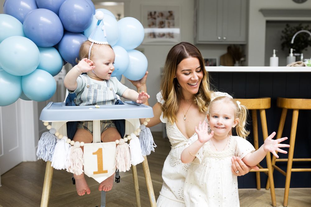 mum with two children celebrating their join birthdays