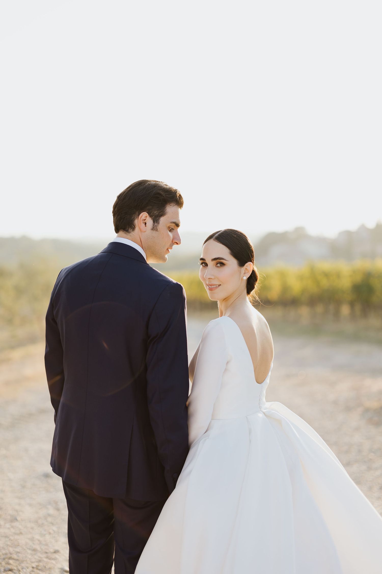 Bride and groom embracing during an elegant wedding at Fattoria di Montecchio in Tuscany.