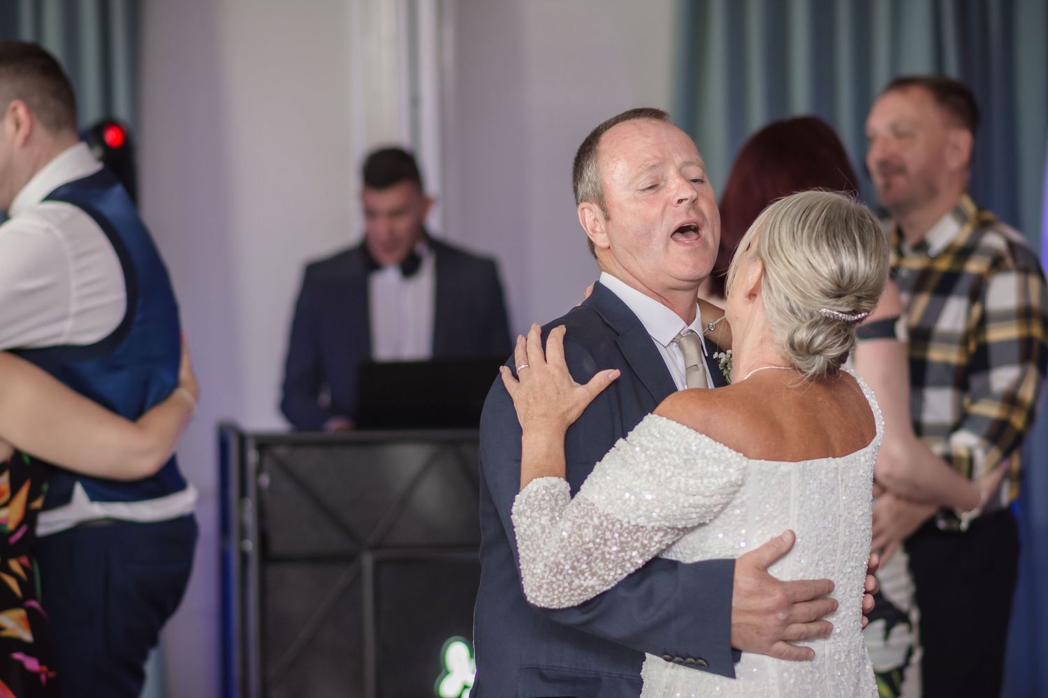 People dancing together at what appears to be a social dance event or party.