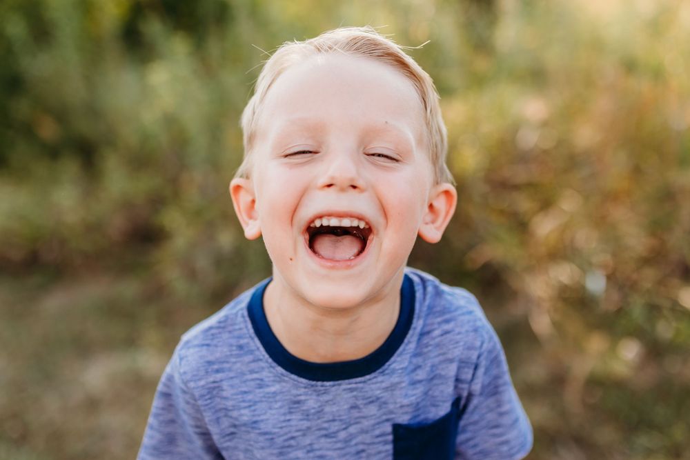 Joyful boy posing for school portrait. Cincinnati and NKY School and Homeschool Portrait Photographer. A modern approach to picture day.