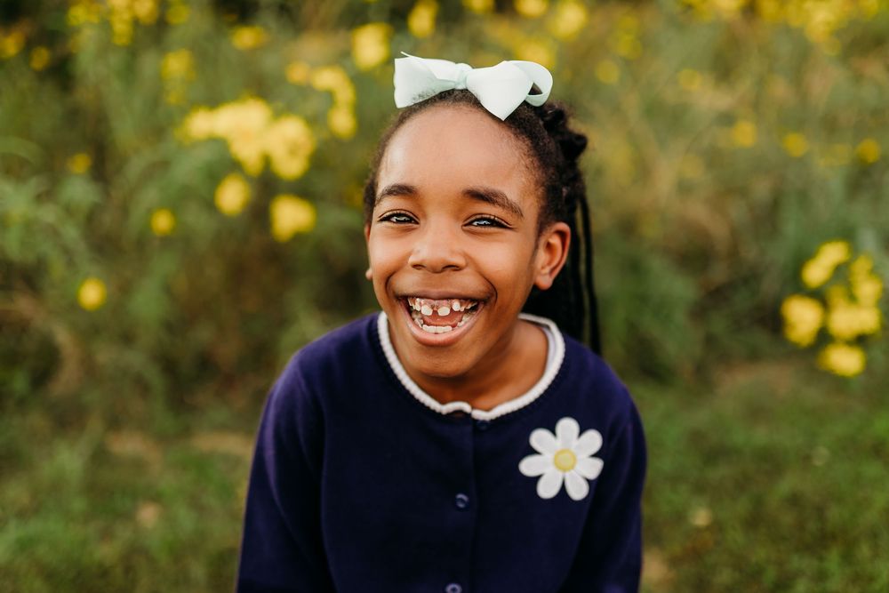 Cute girl smiling for a portrait. Cincinnati and Kentucky School and Homeschool Portrait Photographer. A modern approach to picture day.