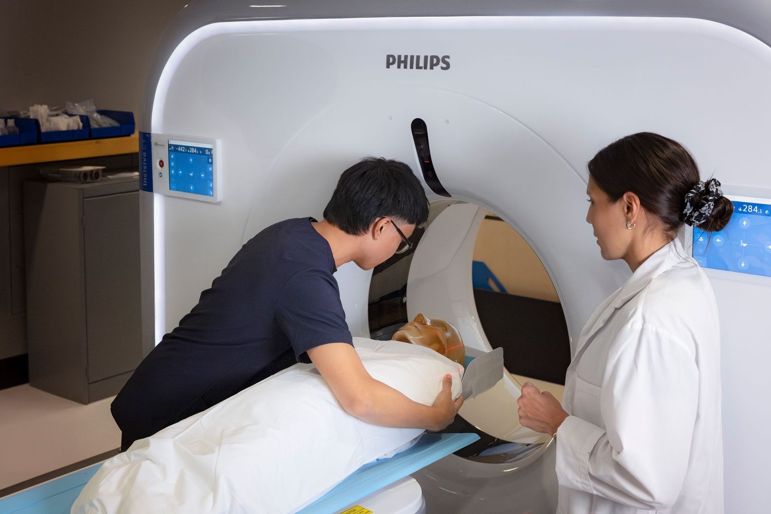 Medical imaging equipment including Philips machines arranged in a clinical setting.