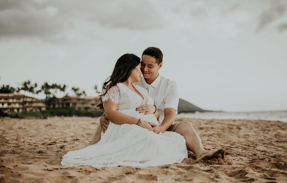 Romantic beach wedding photography sequence captured on sandy shoreline at sunset.