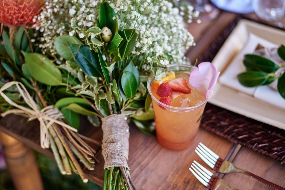 Rustic table decorations with floral arrangements and place settings for a special event.