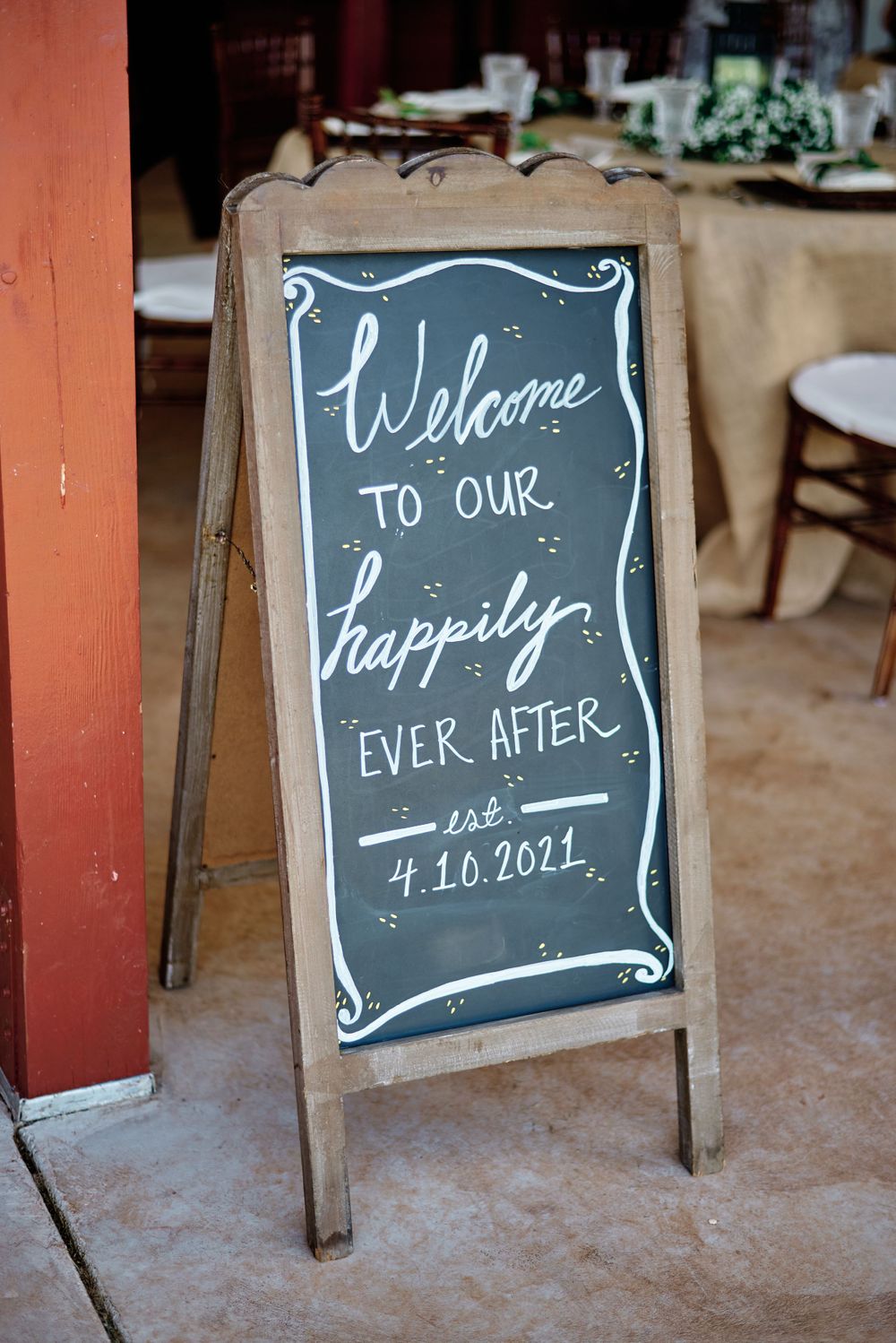 Rustic chalkboard wedding signs displaying welcome messages and the wedding date.