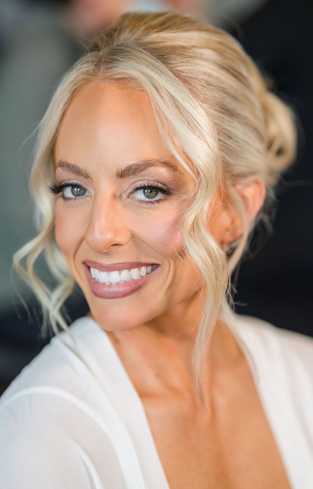 Close-up portraits showing bright smiles and blonde hair against a dark background.