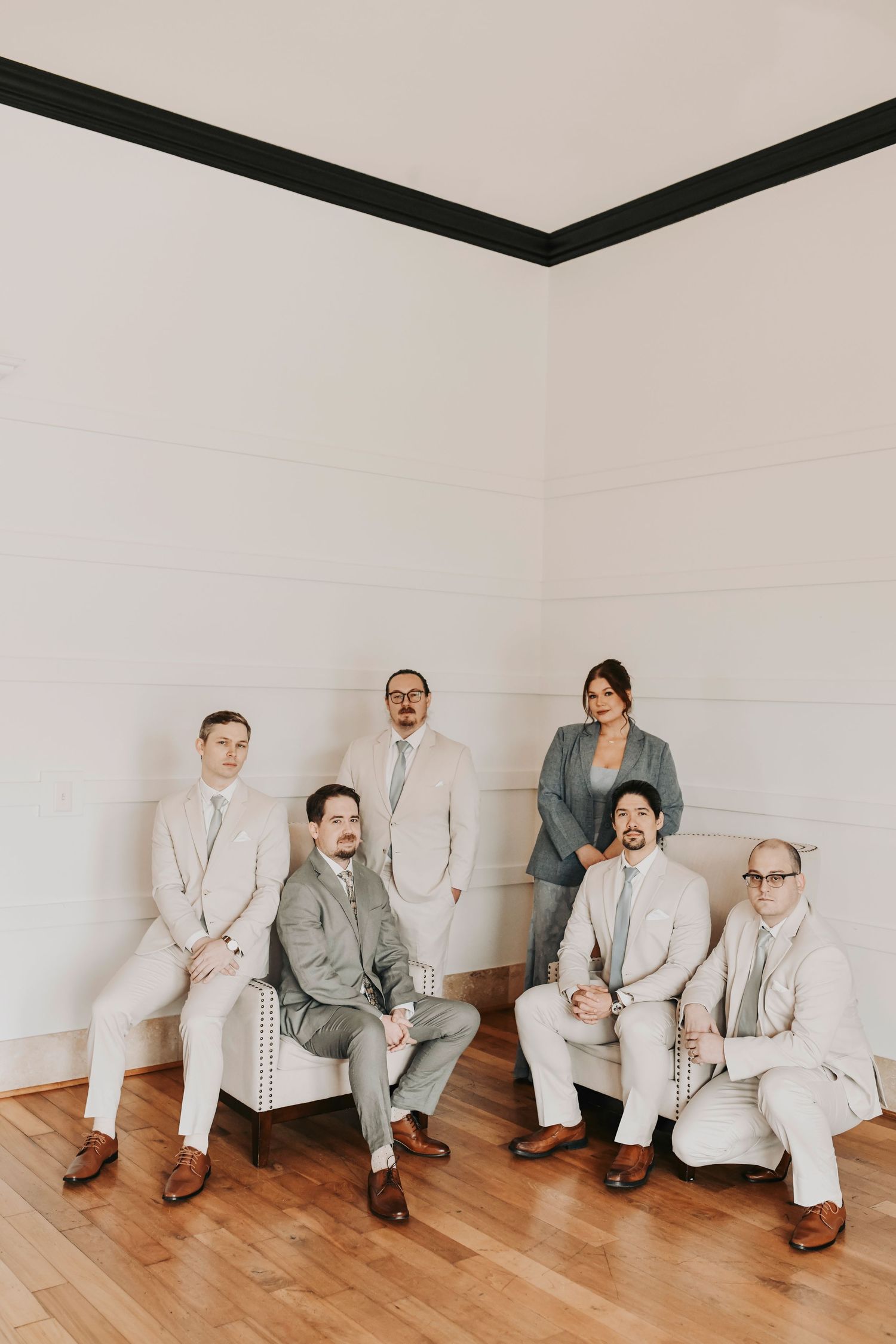 Female groomsman wearing a sophisticated powder blue floor-length gown with the wedding party