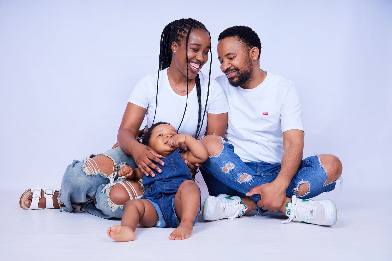 Family photo session showing playful moments on white background.