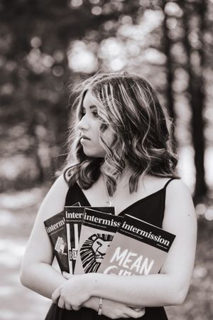 Black and white portrait series with books creating a moody artistic atmosphere.