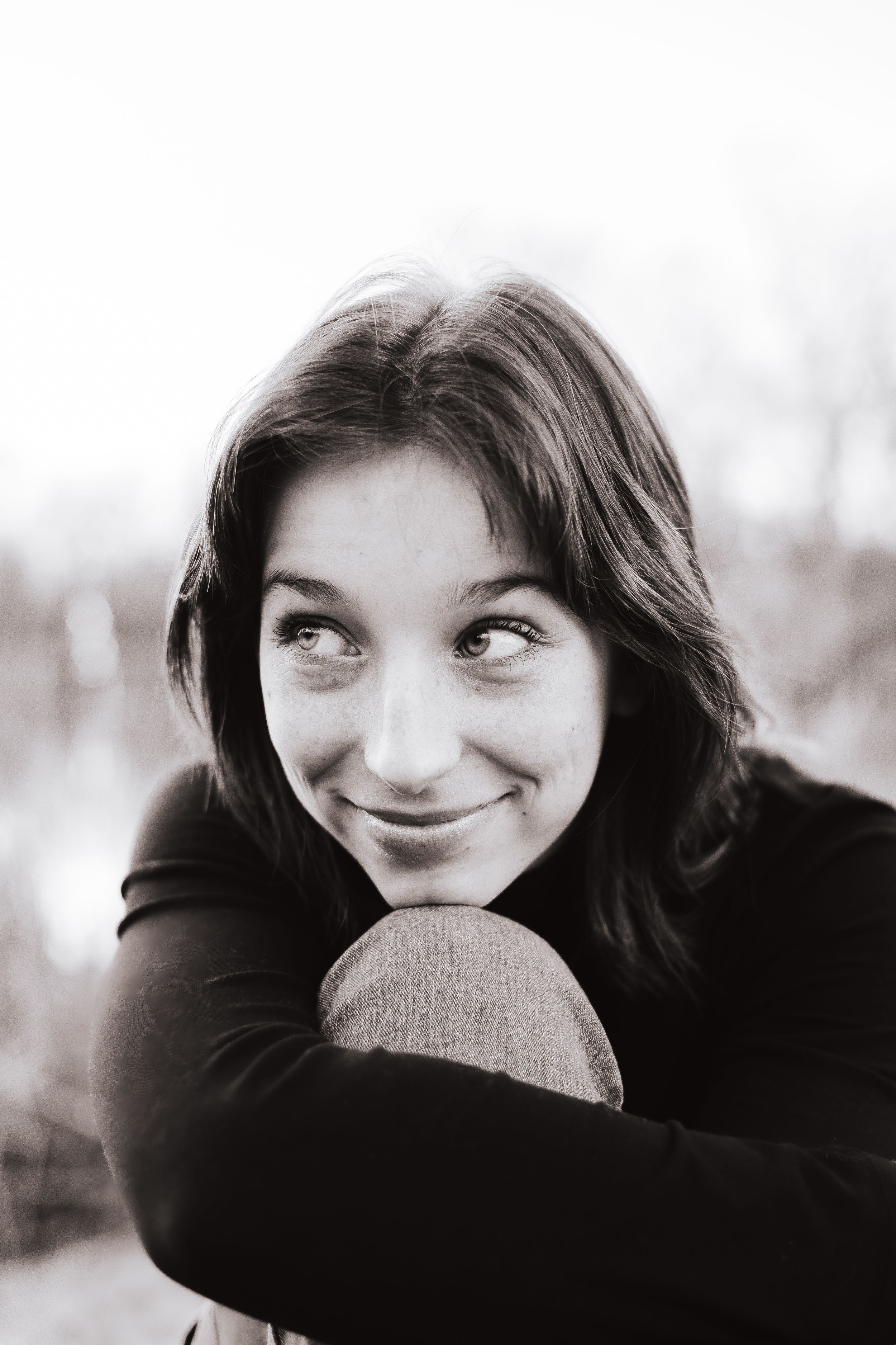 Black and white photo sequence capturing playful expressions and emotions.