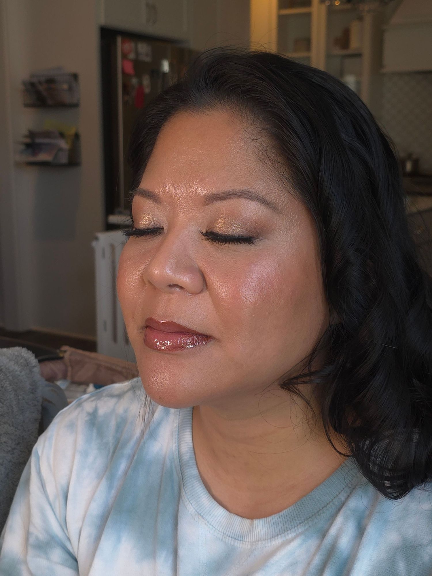 Close up beauty shots showing glossy makeup and glowing skin.