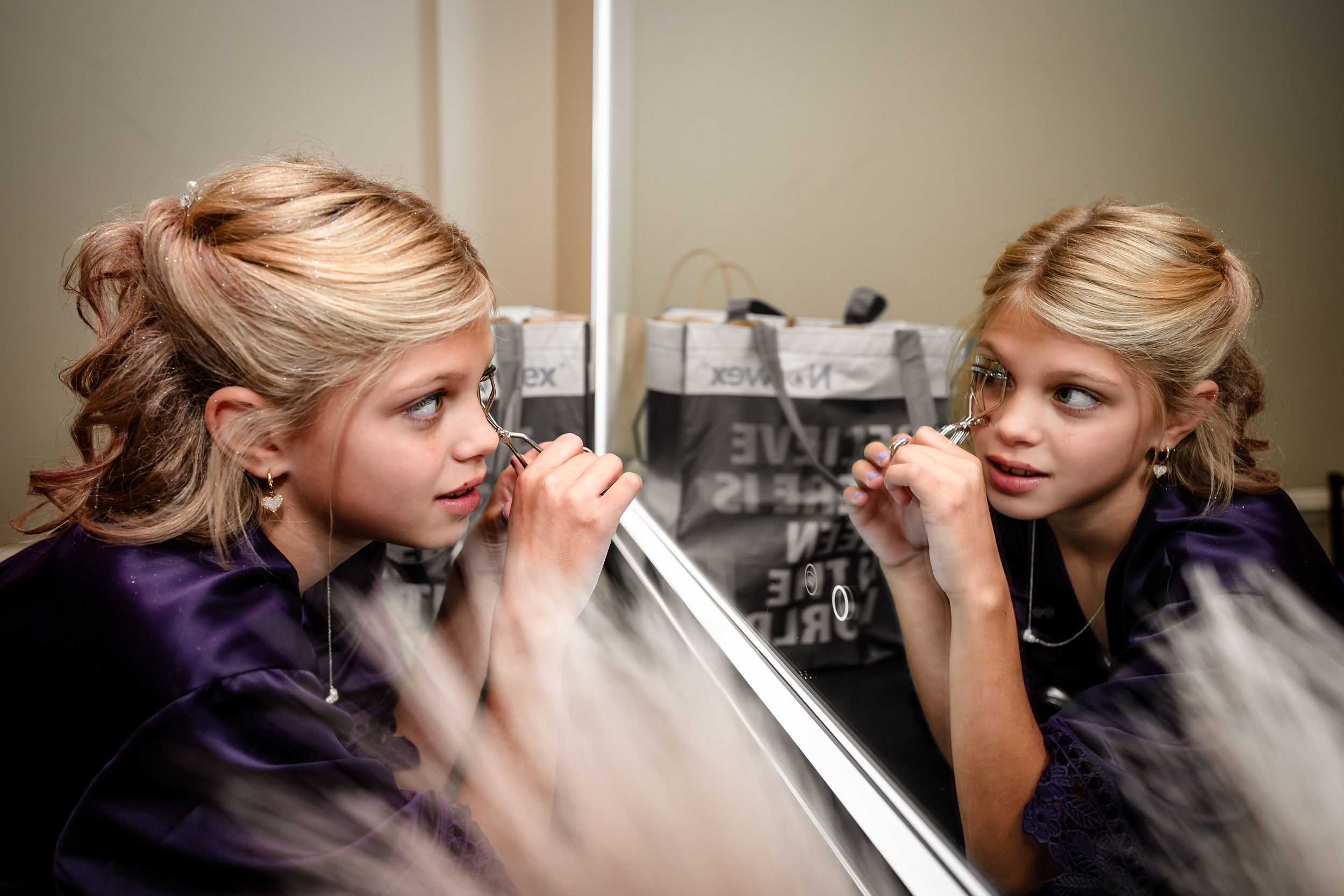 Getting ready sequence showing hair styling preparations before the wedding ceremony.