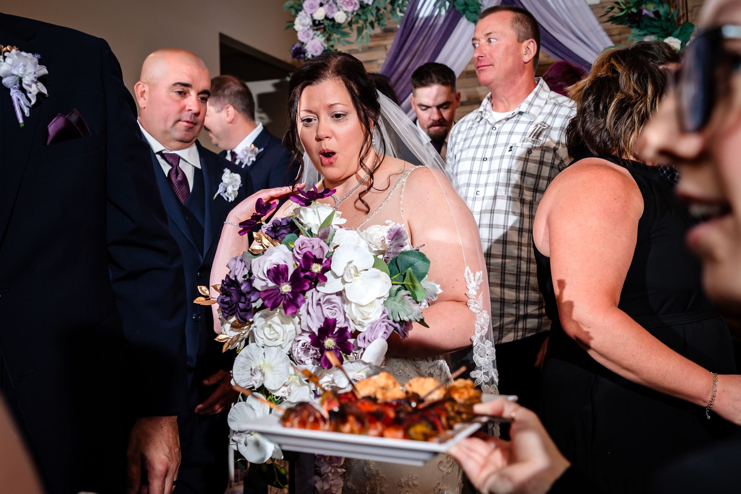 Wedding reception celebration with guests enjoying festivities in an elegant venue.