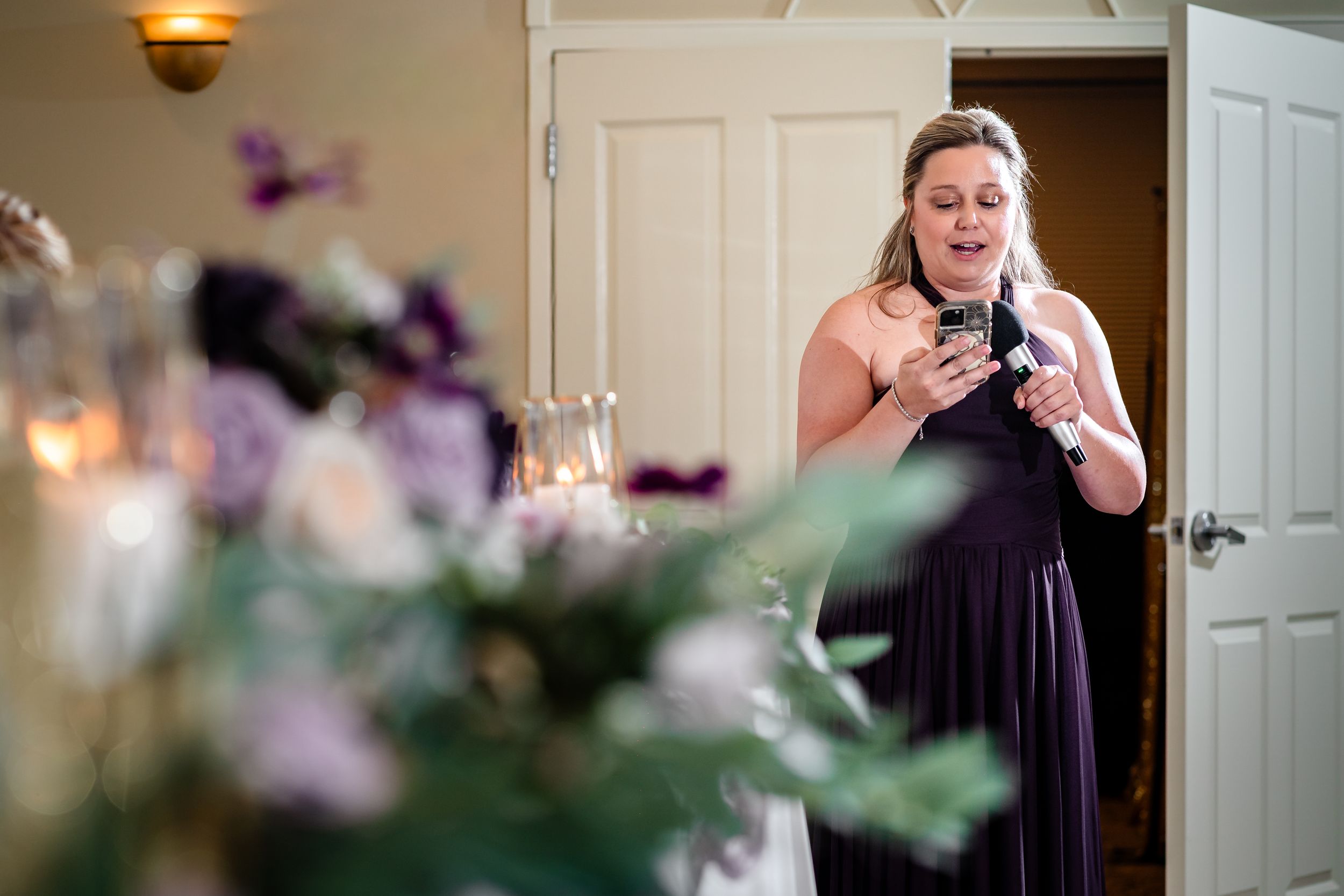 Wedding reception venue with soft lighting and elegant decor details.