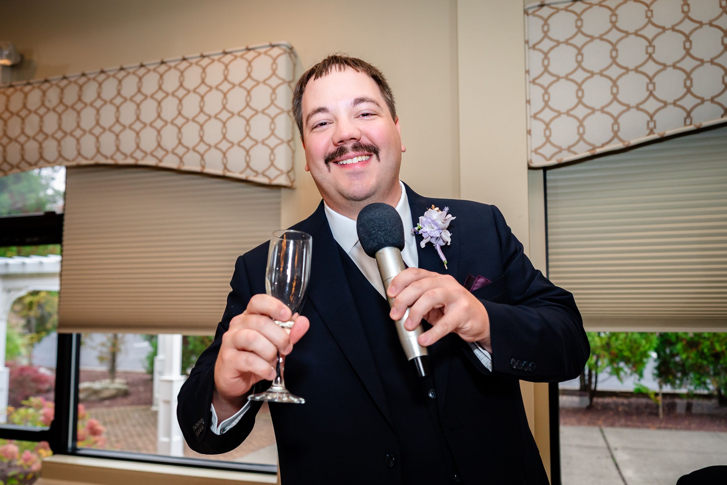 Candid moments captured during wedding reception toasts and speeches.