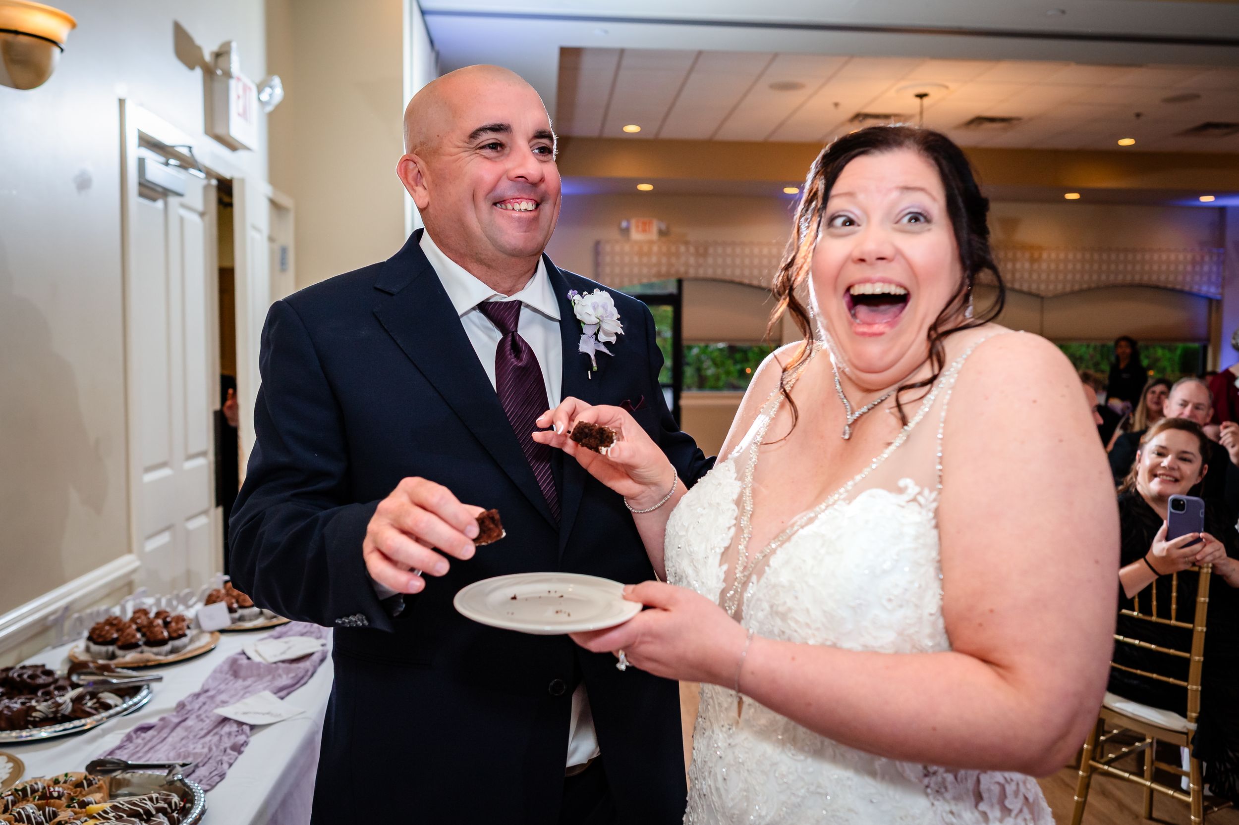 Joyful moments shared between guests during wedding reception festivities.