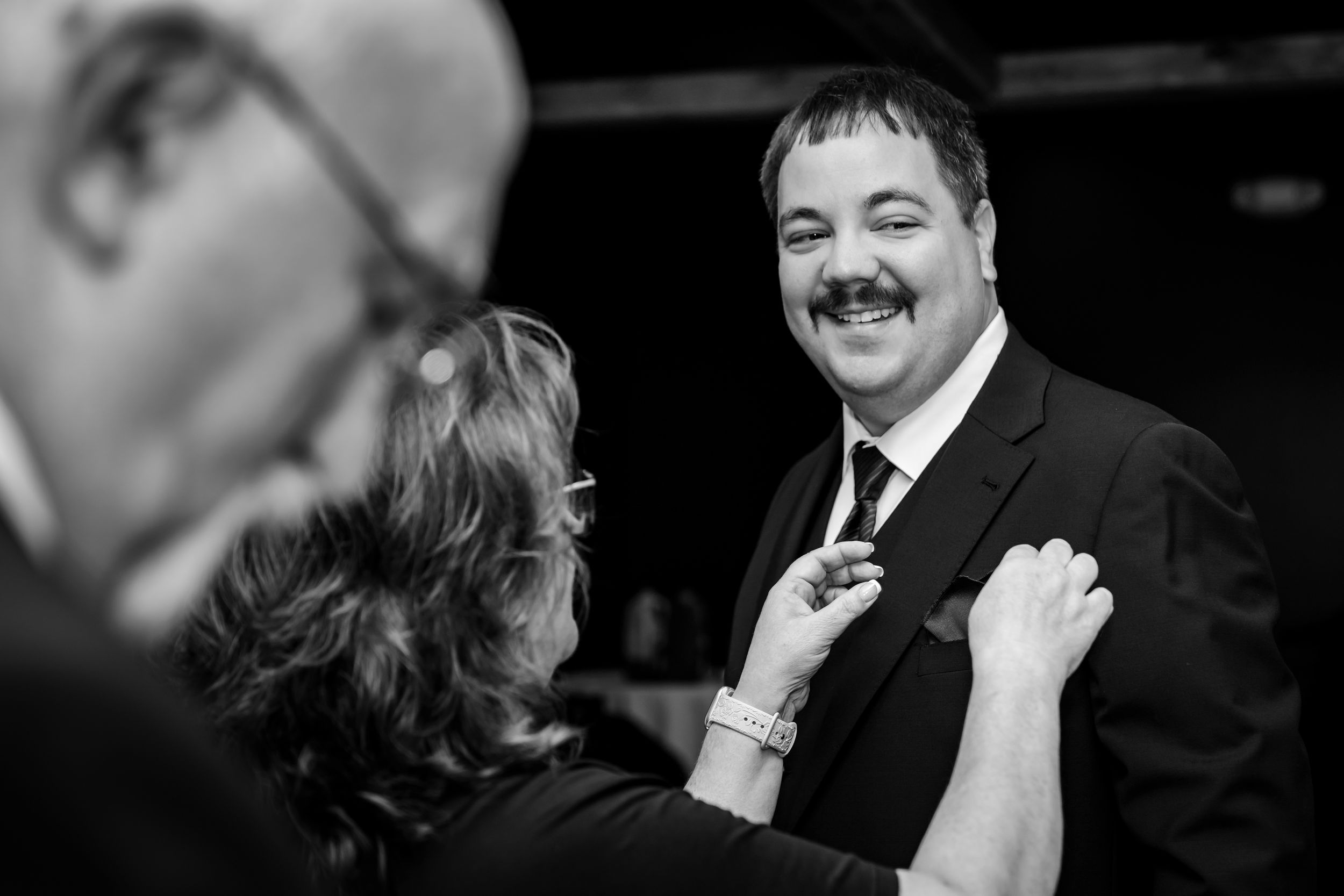 Candid black and white shots of joyful pre-wedding moments.