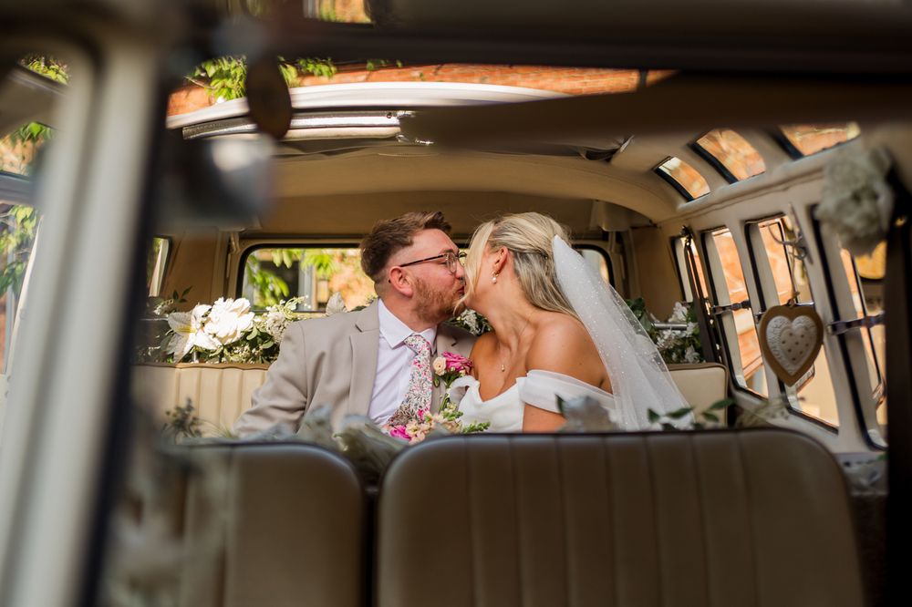 Interior shots of a classic VW campervan with beige leather seats.