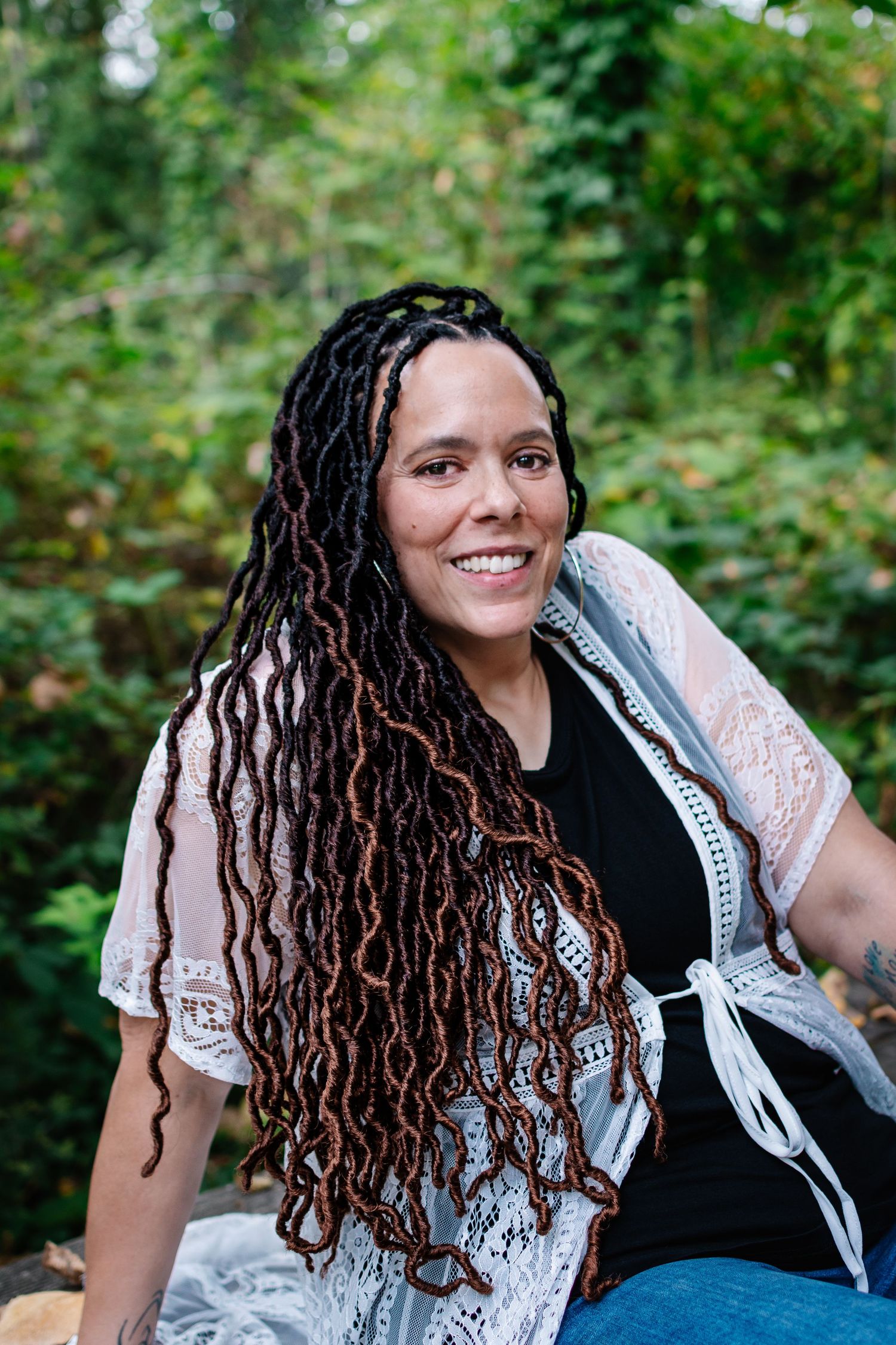 Close-up of woman smiling during milestone birthday photoshoot at Flaming Geyser Park near Seattle.